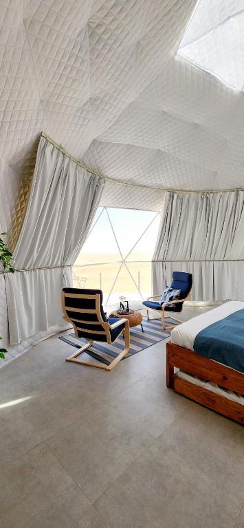 Letto o letti in una camera di Starry Domes Desert Camp