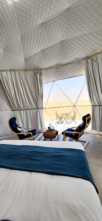Letto o letti in una camera di Starry Domes Desert Camp