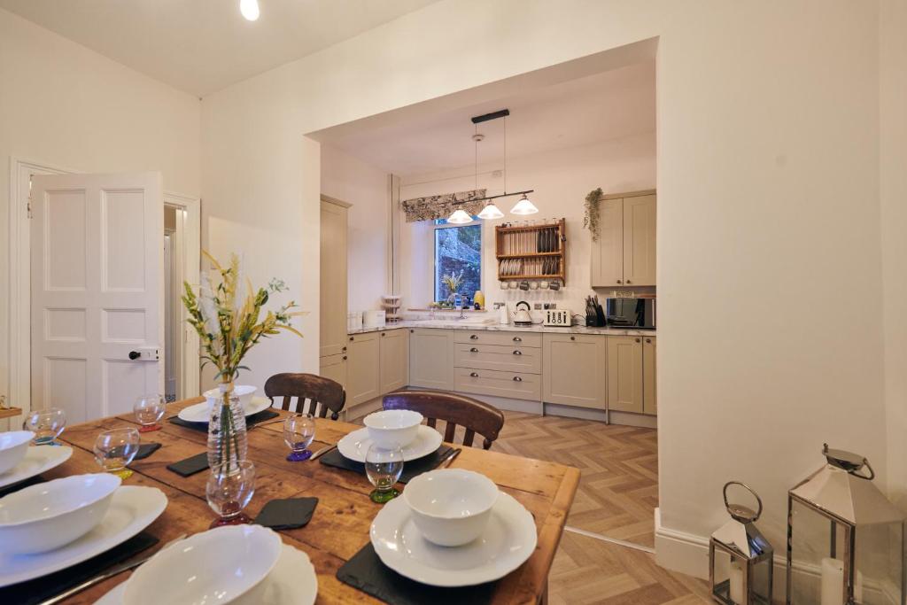 a kitchen and dining room with a table and chairs at The Haven in Llandeilo