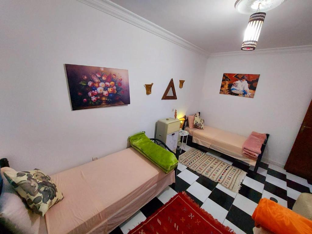 Letto o letti in una camera di Dar Rita