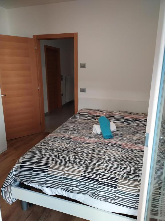 Łóżko lub łóżka w pokoju w obiekcie Casa Mirella