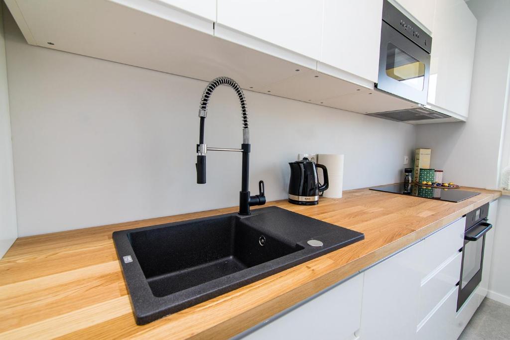 Kuchyňa alebo kuchynka v ubytovaní Apartament KOPERNIK w centrum