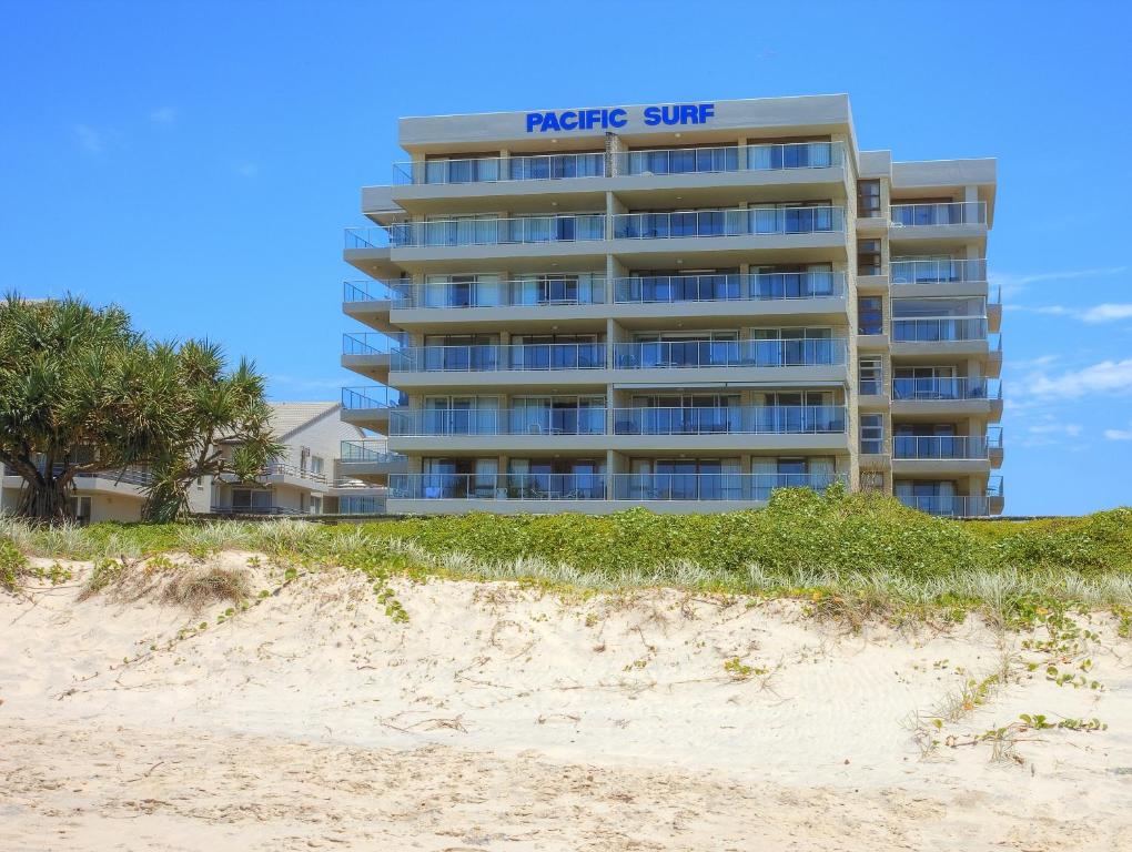 a hotel on the beach next to a sandy beach at Pacific Surf Absolute Beachfront Apartments in Gold Coast