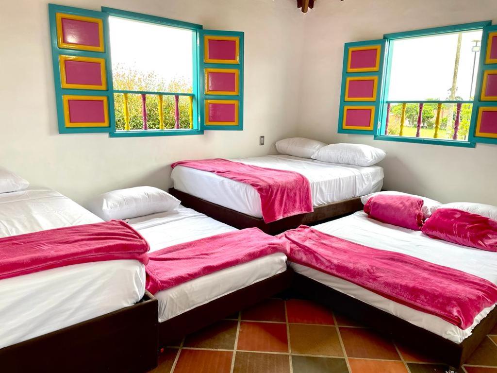 Postel nebo postele na pokoji v ubytování Hacienda El Encanto
