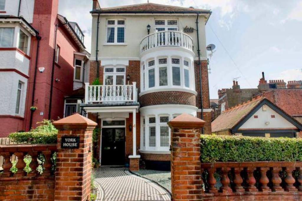 a large white house with a balcony on top of it at 3 Bedroom Spacious Seaside Apartment with Estuary Views in Southend-on-Sea