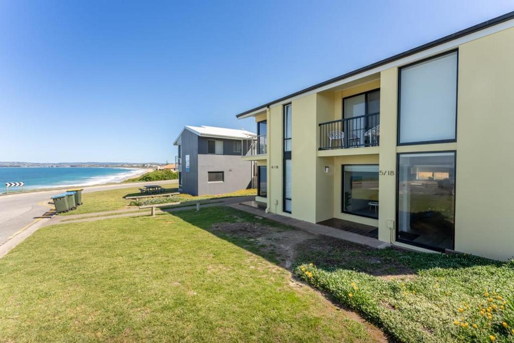 an apartment building with a view of the beach at South Seas 5- Absolute Beachfront Wifi Views in Port Elliot