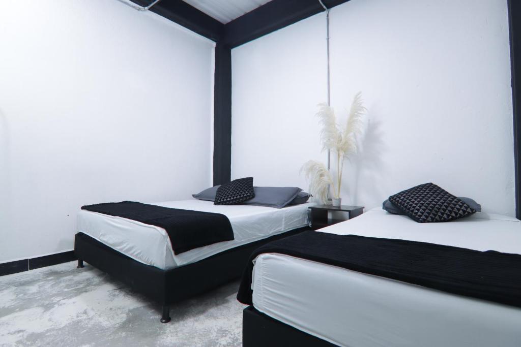Postel nebo postele na pokoji v ubytování Hotel Casa Malibú