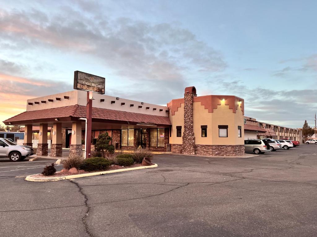 a parking lot in front of a hotel at Brentwood Inn & Garden in Farmington