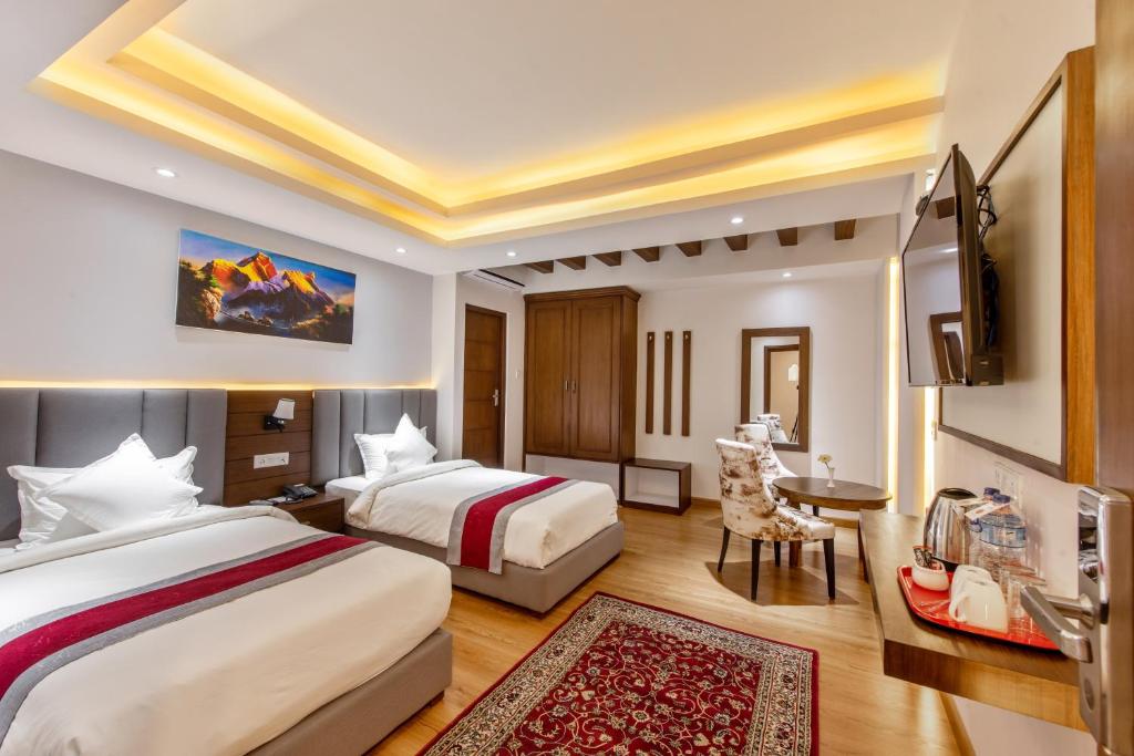 Postel nebo postele na pokoji v ubytování Hotel Ama-La, Thamel, Kathmandu