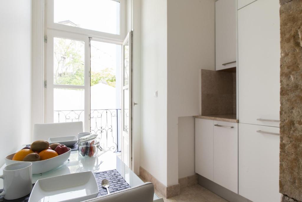Kuchyň nebo kuchyňský kout v ubytování JOIVY Downtown Blue Apartments