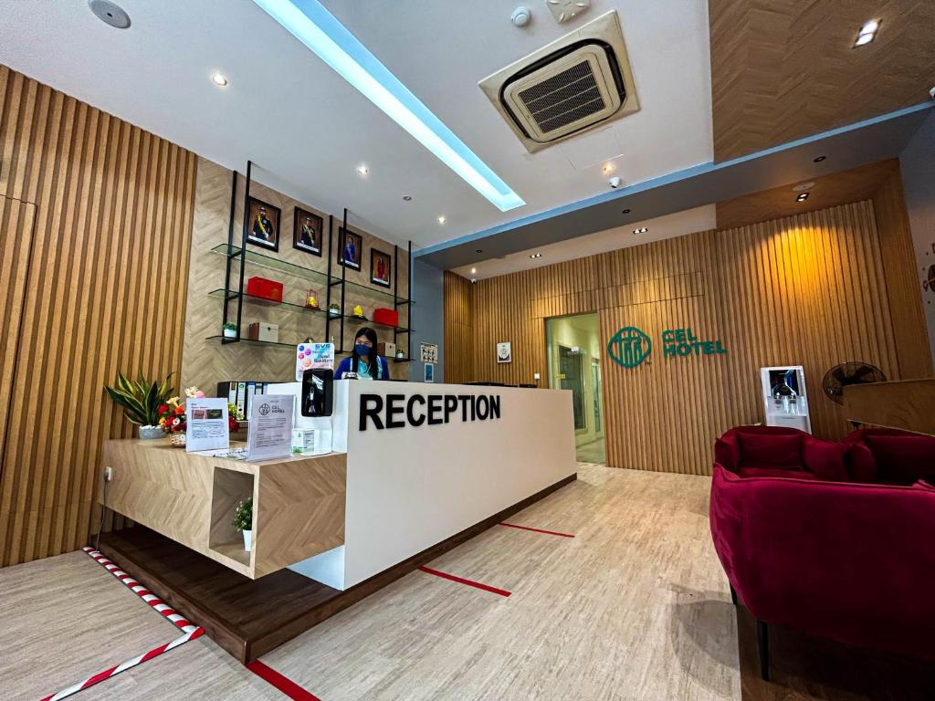 a reception room with a reception desk in a store at Cel Hotel in Skudai