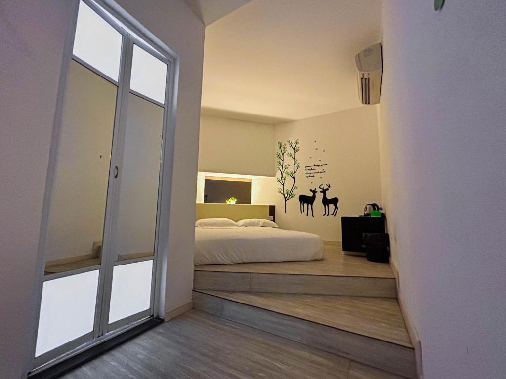 Postel nebo postele na pokoji v ubytování Cel Hotel