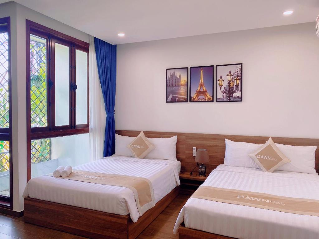 Postel nebo postele na pokoji v ubytování Dawn Villa Homestay Hội An