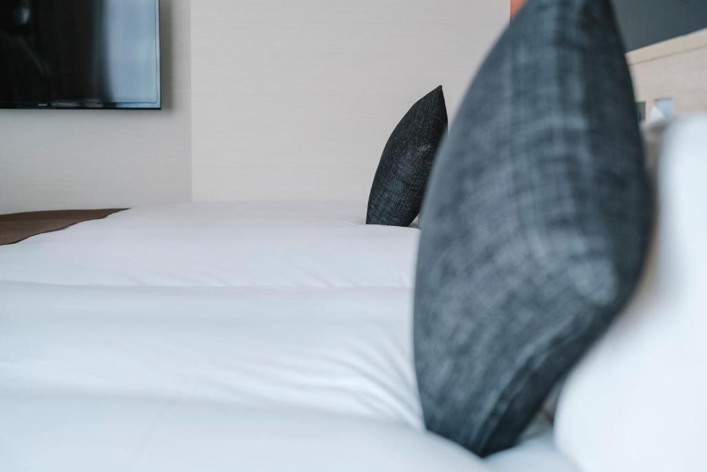 Postel nebo postele na pokoji v ubytování Hotel JAL City Haneda Tokyo West Wing