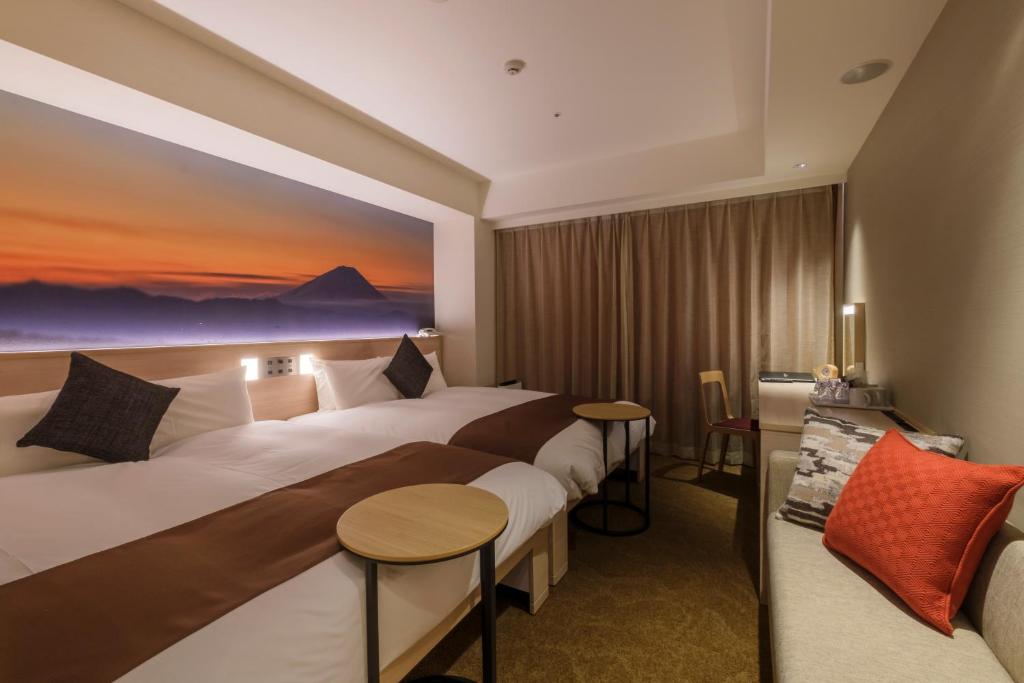 Postel nebo postele na pokoji v ubytování Hotel JAL City Haneda Tokyo West Wing