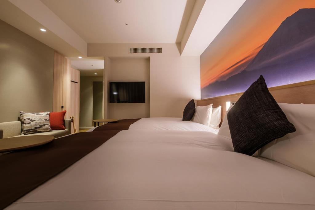 Postel nebo postele na pokoji v ubytování Hotel JAL City Haneda Tokyo West Wing