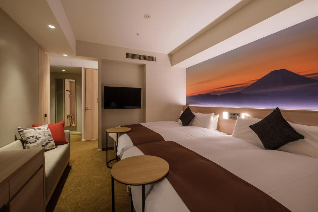 Postel nebo postele na pokoji v ubytování Hotel JAL City Haneda Tokyo West Wing