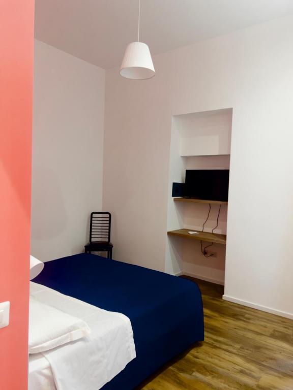 Postel nebo postele na pokoji v ubytování Hotel Ausonia
