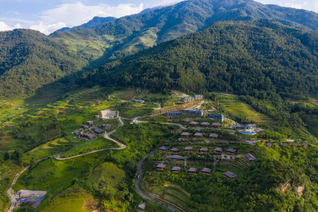 an aerial view of a village in the mountains at Le Champ Tu Le Resort Hot Spring & Spa in Yen Bai