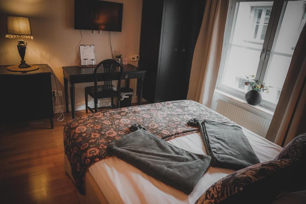 Postel nebo postele na pokoji v ubytování Mojo Hotell