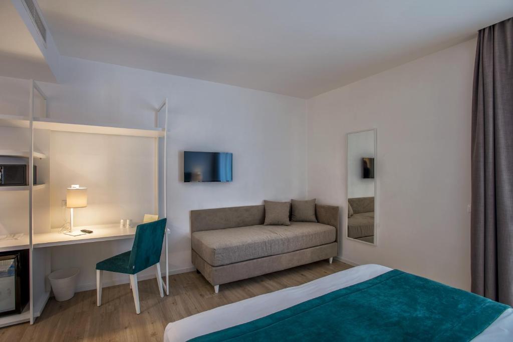 Postel nebo postele na pokoji v ubytování Hotel Isabella Sorrento
