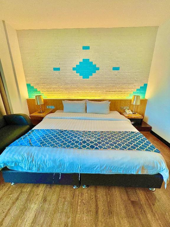 Postel nebo postele na pokoji v ubytování New World Express Motel