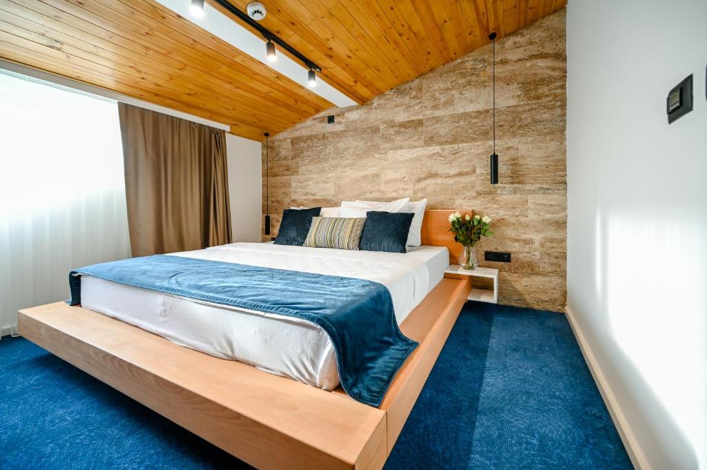Voodi või voodid majutusasutuse Hotel Borovi Forest Resort & Spa toas