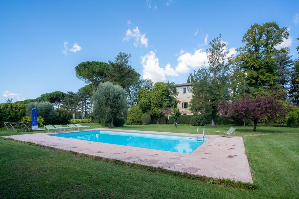 a swimming pool in the yard of a house at Villa Lama by Mmega in Lama