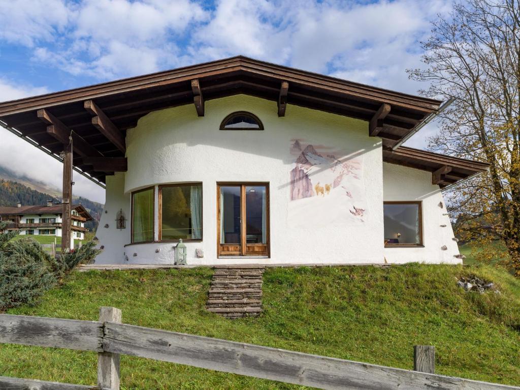 a house on the side of a hill at Ferienhaus Widmann in Kirchberg in Tirol