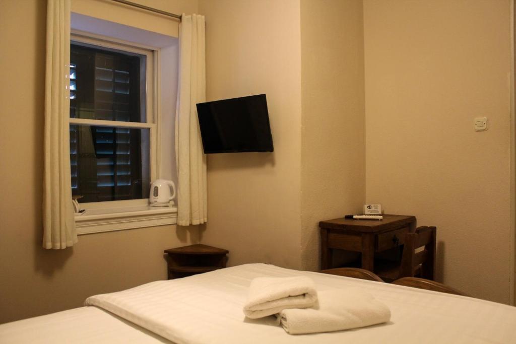 Postel nebo postele na pokoji v ubytování Villa Varoš