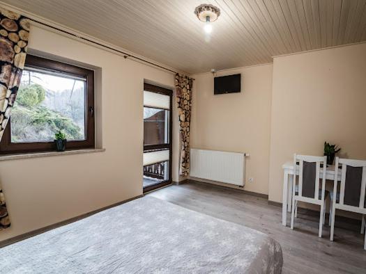 Posteľ alebo postele v izbe v ubytovaní Apartamenty na wzgórzu