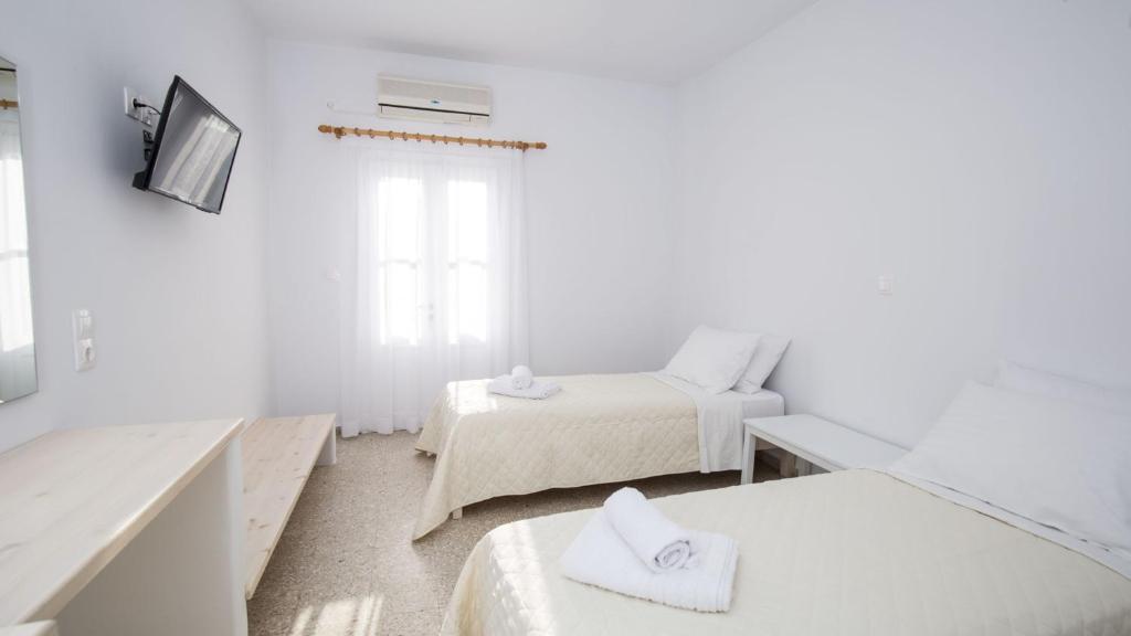 Postel nebo postele na pokoji v ubytování Hotel Galini Sifnos