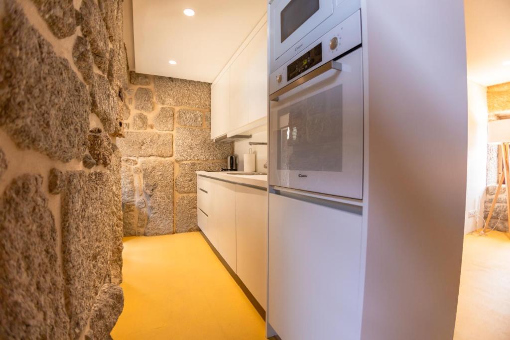 Kuchyň nebo kuchyňský kout v ubytování Quinta da Corredoura, Hotel Rural