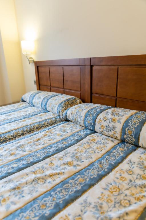 Posteľ alebo postele v izbe v ubytovaní Apartamentos & casas rurales Santo Domingo de Silos