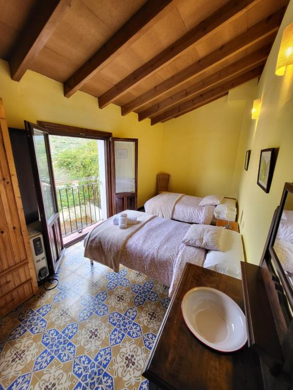 Postel nebo postele na pokoji v ubytování Casa Rural La Severina