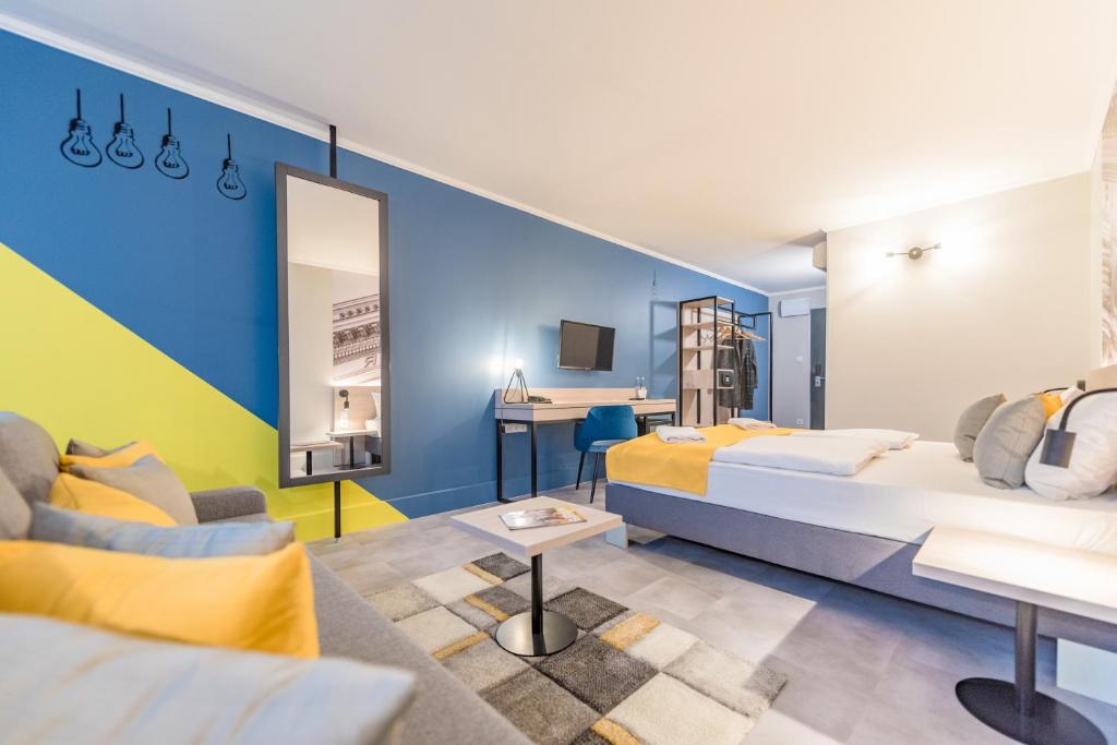 Postel nebo postele na pokoji v ubytování Impulso Fashion Hotel