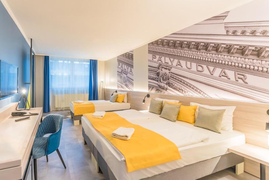 Postel nebo postele na pokoji v ubytování Impulso Fashion Hotel