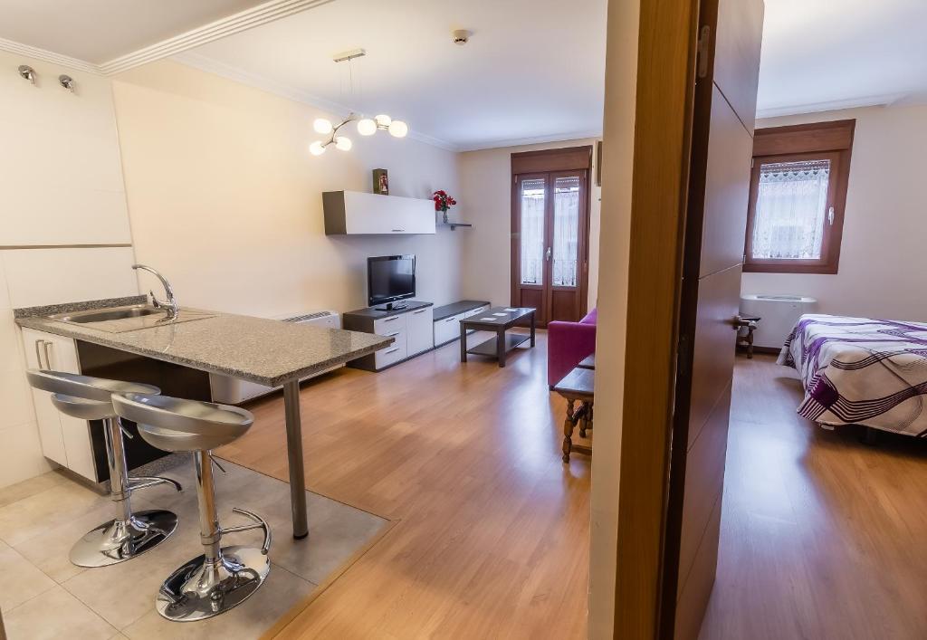 Posteľ alebo postele v izbe v ubytovaní Apartamentos & casas rurales Santo Domingo de Silos