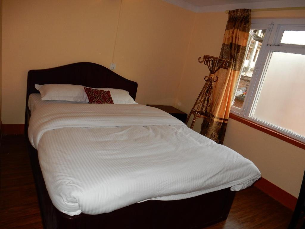 Postel nebo postele na pokoji v ubytování Andes House