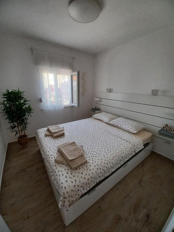 Postel nebo postele na pokoji v ubytování Apartments Sava
