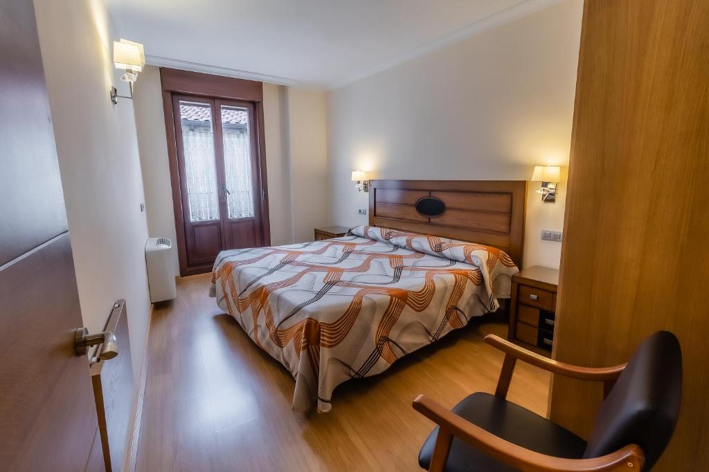 Posteľ alebo postele v izbe v ubytovaní Apartamentos & casas rurales Santo Domingo de Silos