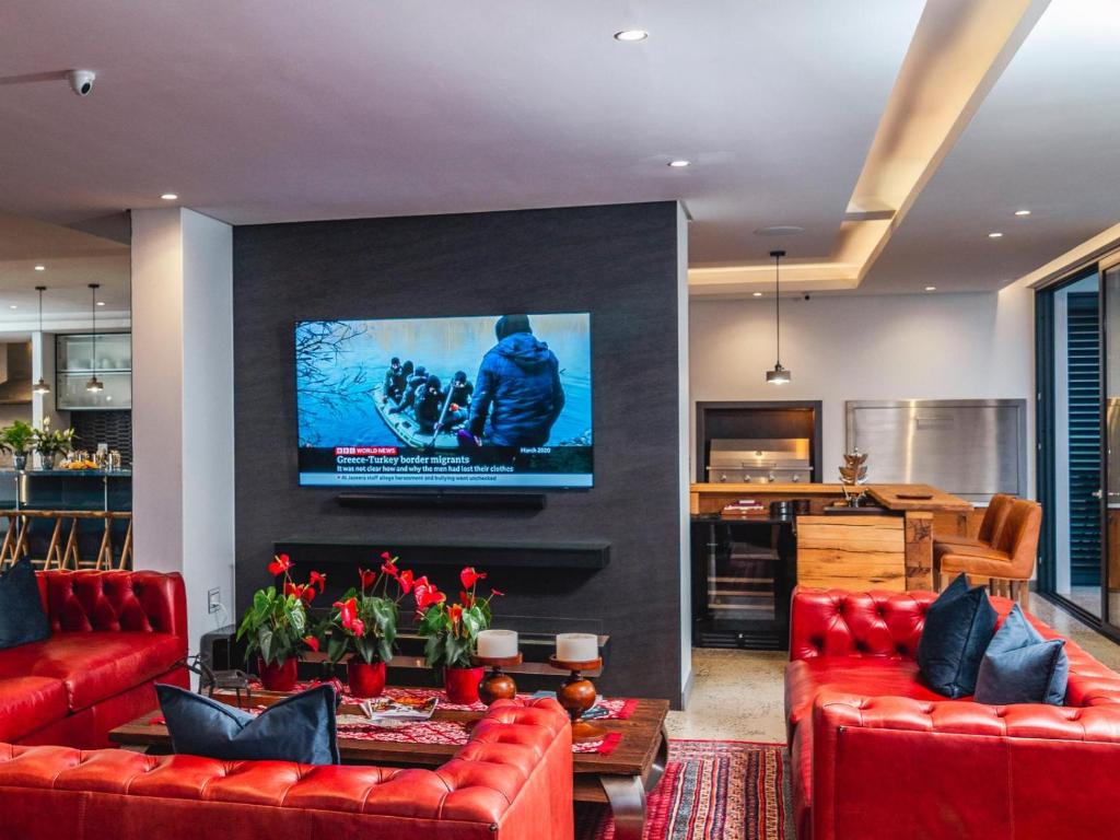 TV a/nebo společenská místnost v ubytování Boutique Ocean Views - incorporating Wendy's