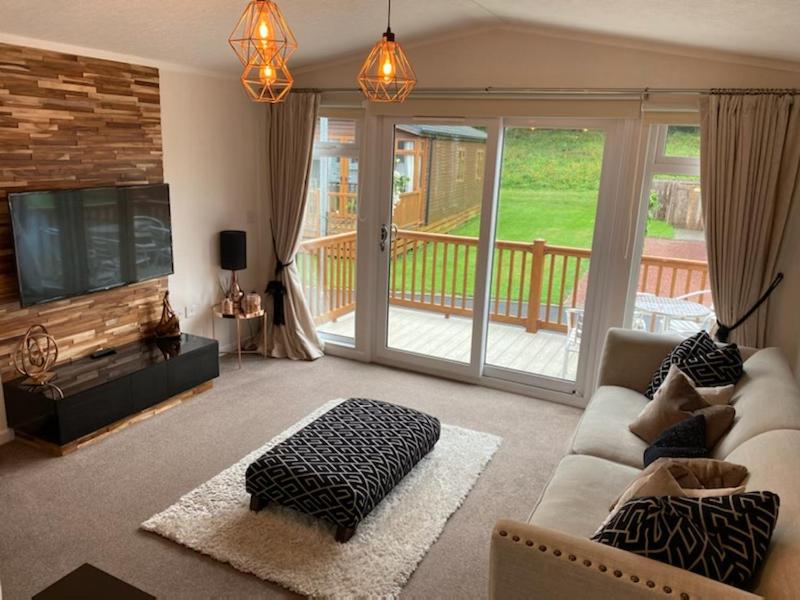 a living room with a couch and a television at Hermanas retreat in Felton