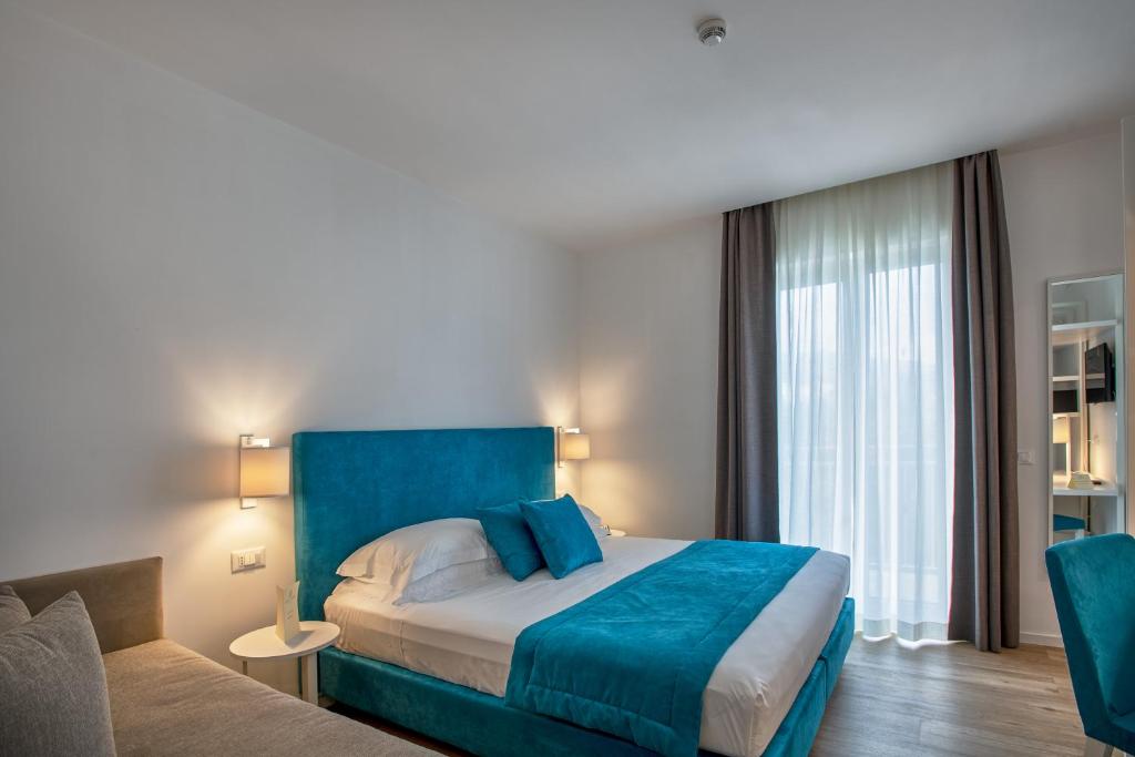 Postel nebo postele na pokoji v ubytování Hotel Isabella Sorrento