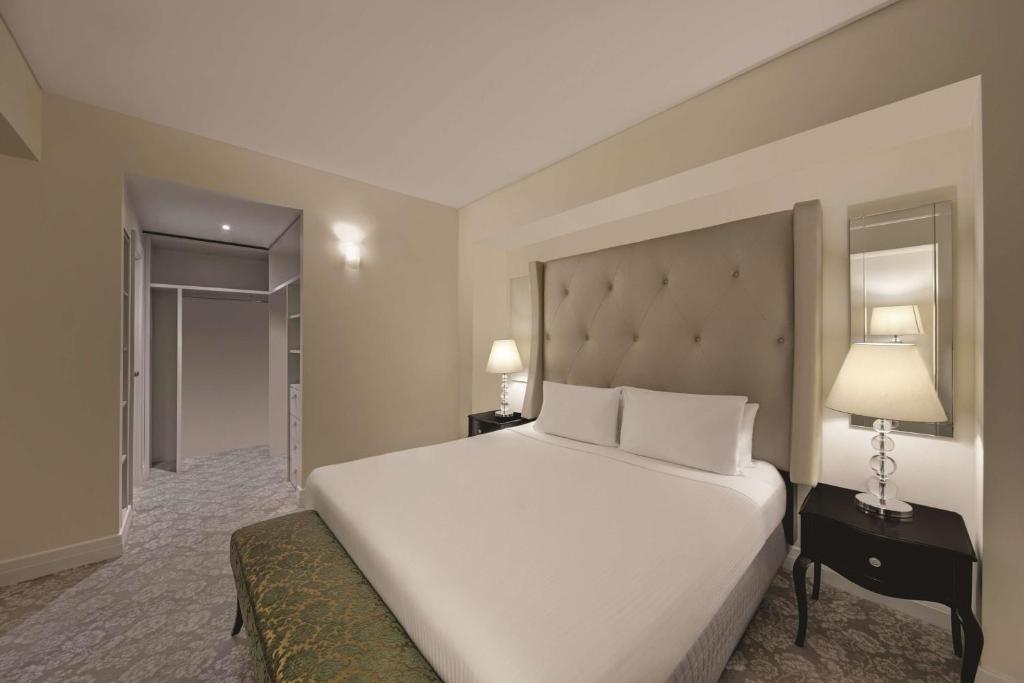 Postel nebo postele na pokoji v ubytování Rendezvous Hotel Melbourne