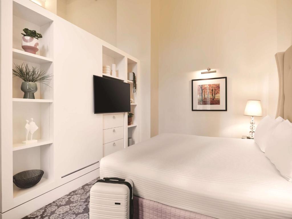 Postel nebo postele na pokoji v ubytování Rendezvous Hotel Melbourne