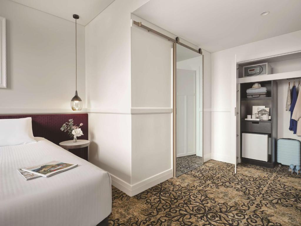 Postel nebo postele na pokoji v ubytování Rendezvous Hotel Melbourne