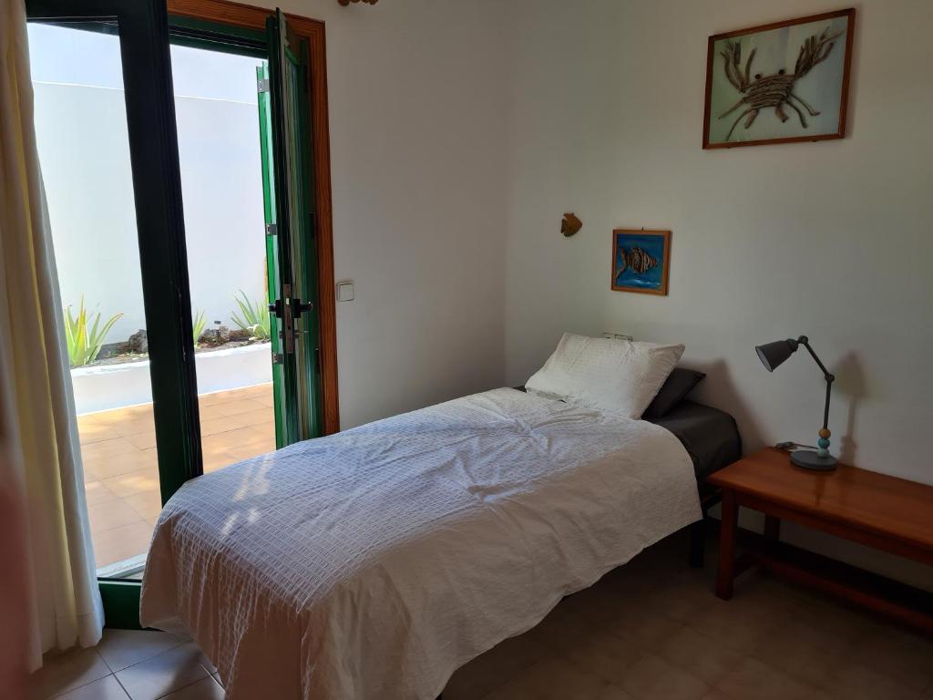 Łóżko lub łóżka w pokoju w obiekcie Cozy Waterman beach house