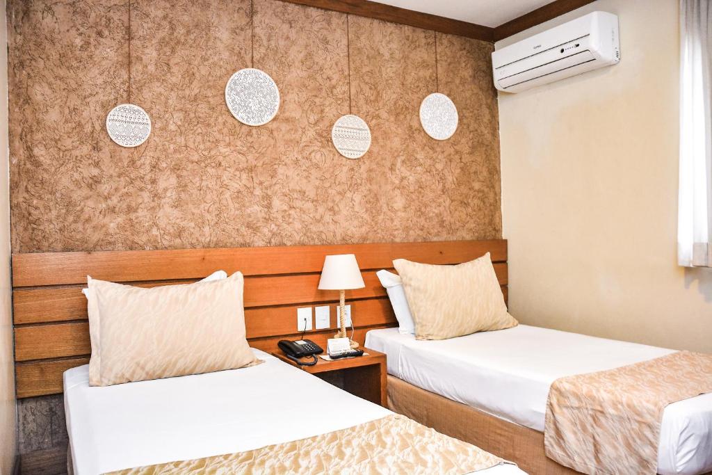 Ένα ή περισσότερα κρεβάτια σε δωμάτιο στο Carppa Hotel