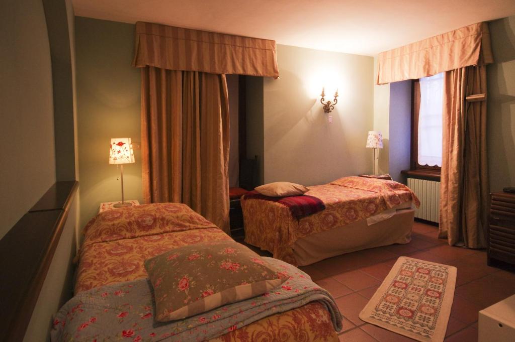 Postel nebo postele na pokoji v ubytování B&B il Baciass